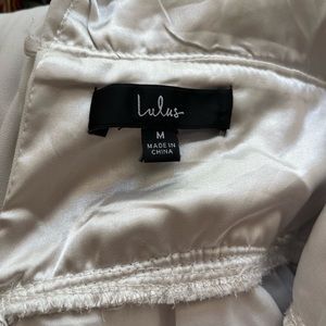 White engagement party rehearsal dinner jumpsuit